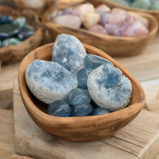 Celestite Tumbled/Clusters - Hamilton Collection 016 in a wooden bowl on a boutique display table