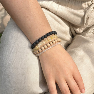 Citrine bead bracelet stacked with other bead bracelets on the wrist