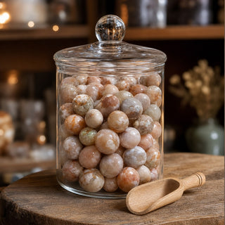 Flower Agate Tumbled Stone in a glass apothecary jar with a scoop