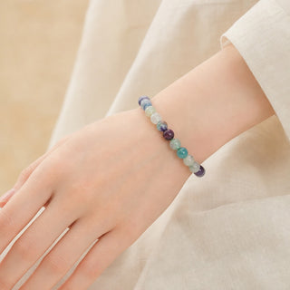Fluorite bead bracelet worn on the wrist, close-up