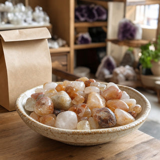Golden Healer A Tumbled Stones in a ceramic bowl on a shop counter