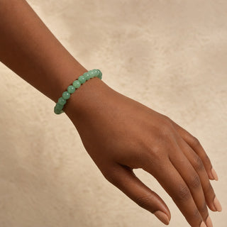 Green Aventurine bead bracelet worn on the wrist, close-up