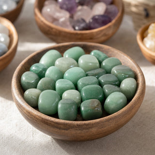 Green Aventurine Tumbled Stones - China in a wooden bowl on a boutique display table