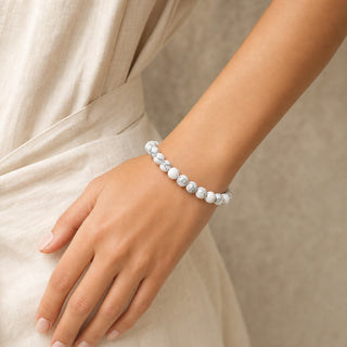 White Howlite bead bracelet worn on the wrist, close-up