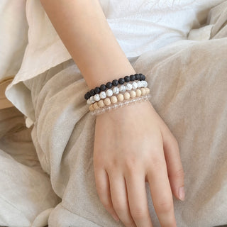 White Howlite bead bracelet stacked with other bead bracelets on the wrist
