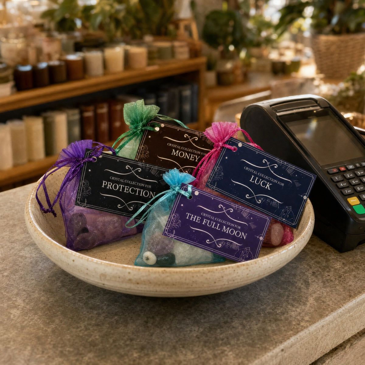 Intention Crystal Collection kits in a ceramic bowl beside the till