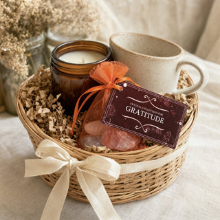 Intention Crystal Collection Gratitude kit in a gift basket with a candle and a mug