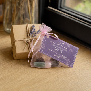 Intention Crystal Collection Love kit beside a small kraft gift box