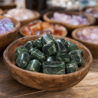 Jade Nephrite Tumbled Stones - Pakistan in a wooden bowl on a boutique display table