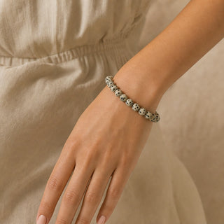 Dalmatian Jasper bead bracelet worn on the wrist, close-up