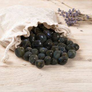 Labradorite A Tumbled Stones - Madagascar spilling from a linen pouch