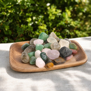 Mixed Natural Tumbled Stones - Brazil in a wooden tray at a market stall