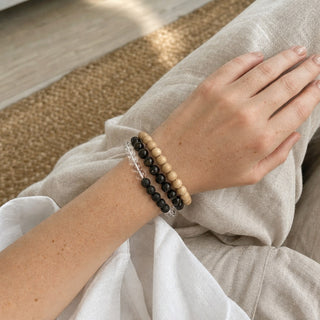 Black Obsidian bead bracelet stacked with other bead bracelets on the wrist