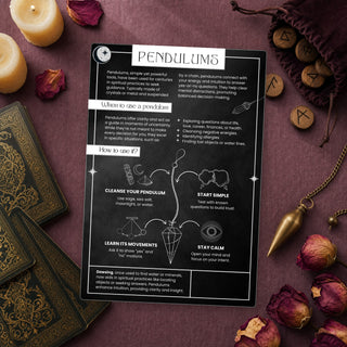 Pendulums QuickStudy Guide laid out with crystals and props