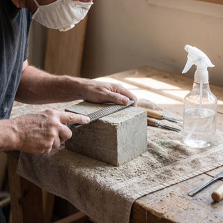 3x3x5 Carving Block - carving soapstone over a damp towel to keep dust down