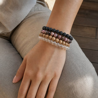 Rhodochrosite bead bracelet stacked with other bead bracelets on the wrist