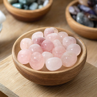 Rose Quartz A Tumbled Stones - India in a wooden bowl on a boutique display table