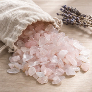Rose Quartz B Assorted spilling from a linen pouch