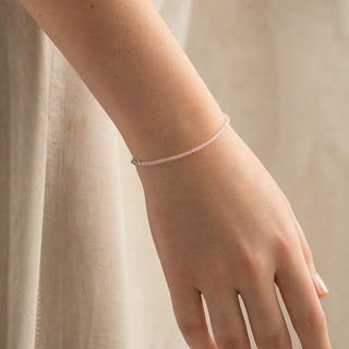 Rose Quartz bead bracelet worn on the wrist, close-up