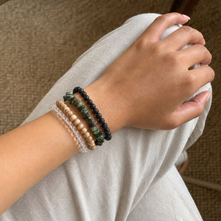 Ruby Zoisite bead bracelet stacked with other bead bracelets on the wrist