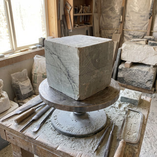 6x6x6 Carving Block - on a sculptor's banding wheel