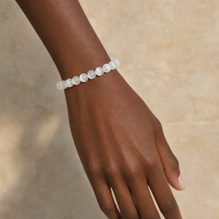 Selenite bead bracelet worn on the wrist, close-up