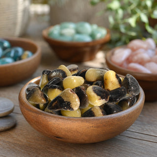 Septarian Tumbled Stones in a wooden bowl on a boutique display table