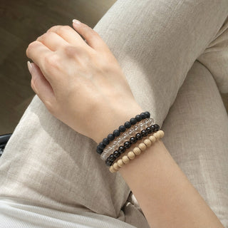 Smoky Quartz bead bracelet stacked with other bead bracelets on the wrist