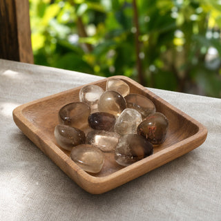 Smoky Quartz E Tumbled Stones - India in a wooden tray at a market stall