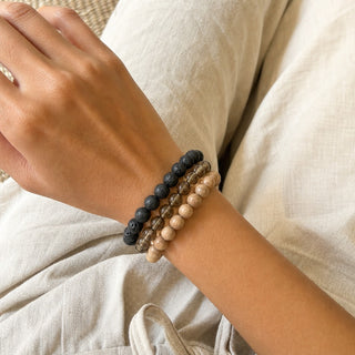 Smoky Quartz bead bracelet stacked with other bead bracelets on the wrist