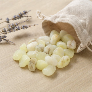 Sulfur Quartz Tumbled Stones spilling from a linen pouch