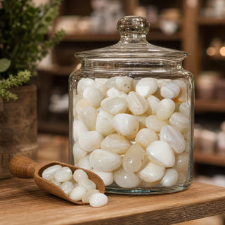 White Banded Agate Tumbled Stones in a glass apothecary jar with a scoop