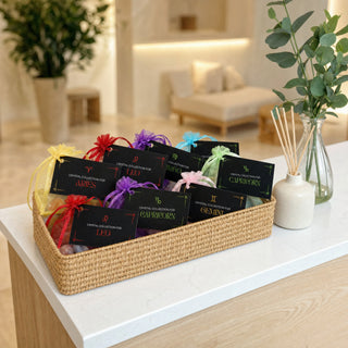 Zodiac Crystal Collection kits in a basket on a spa reception desk