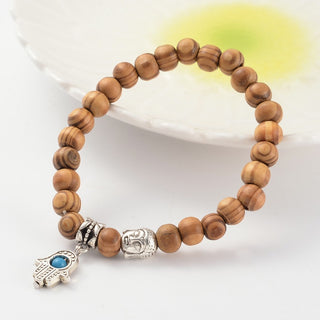 Wood Bead Bracelet with Buddha and Hamsa Charm    from Stonebridge Imports